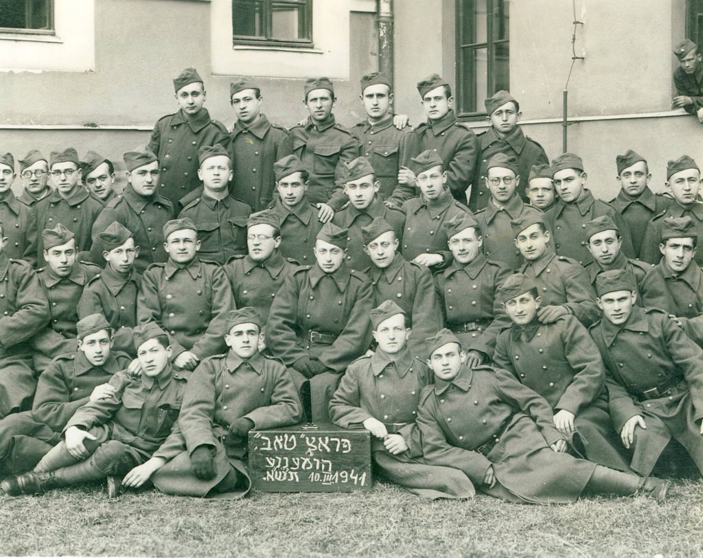 Work Brigade 1941 in Hummene posing by a sign
