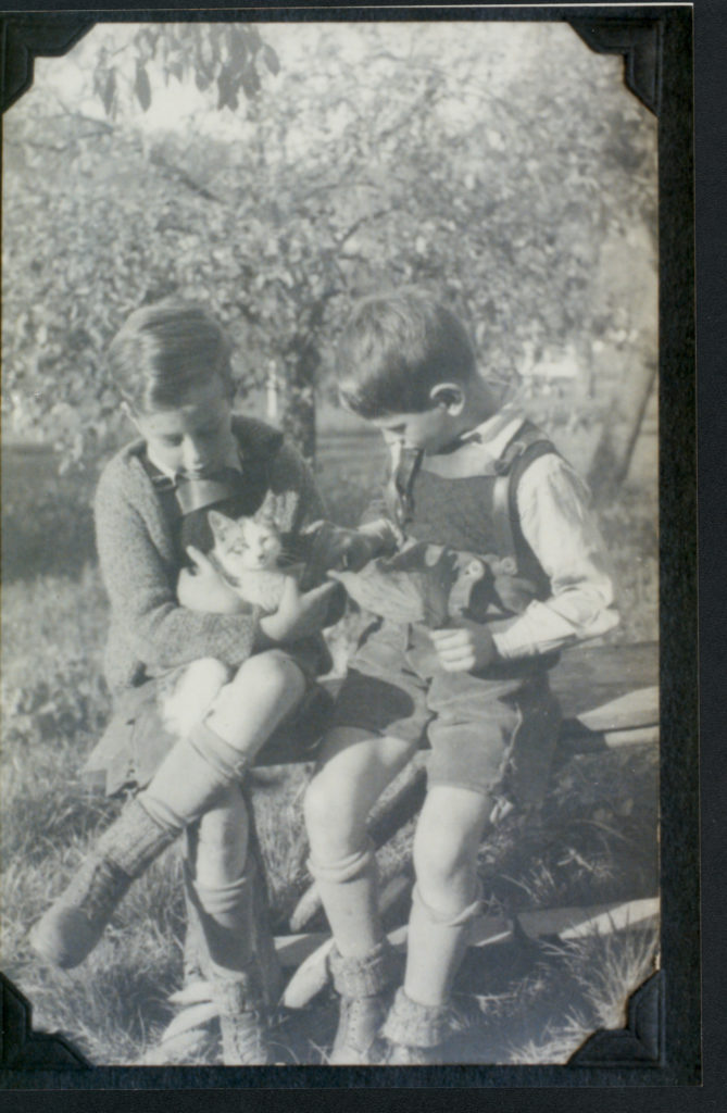 John and Walter Gusdorf as children with a kitten